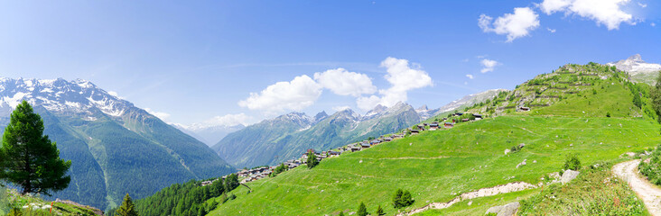 Wide angle view of mountain panorama in the Swiss Alps with Lötschental Valley and Lauchernalp on...