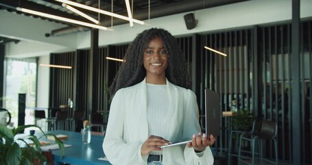 A Confident Businesswoman Is Situated In A Modern Office Workspace, Ready To Thrive