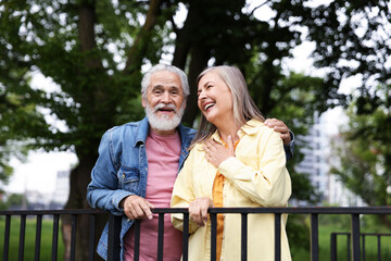 Lovely senior couple walking together in park