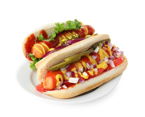 Tasty hot dogs with vegetables, mustard and ketchup isolated on white
