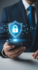 Businessman holding smartphone with glowing security shield illustrating data protection and privacy