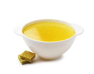 Aromatic bouillon cubes and broth isolated on white