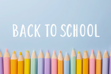 Back to School concept with a row of colorful pencils on a white background. Minimalist top view, flat lay design. A clean, creative banner for education, art, and school supplies.
