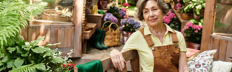 Senior woman enjoys a tranquil moment in a vibrant garden oasis filled with colorful blooms