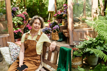 Senior woman enjoys serene moments in her vibrant garden filled with blooming flowers