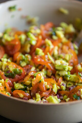 close up stock photo of fresh homemade guacamole in a bowl, perfect for summer, healthy snacking, and refreshing party appetizers
