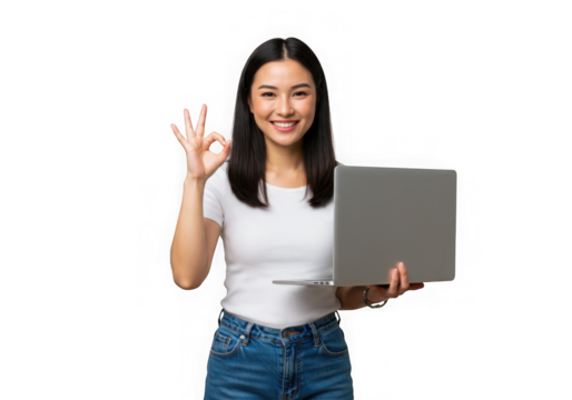 Smiling woman holding laptop and gesturing okay sign with hand on transparent background