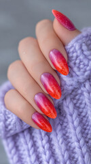 Acrylic nails featuring a striking flame design in vibrant red and orange hues.