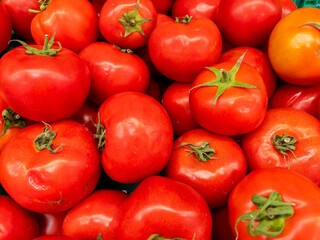 Fresh tomatoes on the market stall, closeup