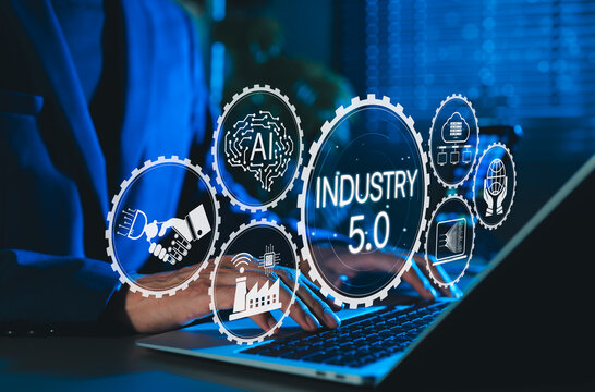 Industry 5.0 Concept. Person using laptop with Industry 5.0, AI icons, smart factory, connectivity, advanced technology integration, human machine collaboration, and future of industrial innovation.