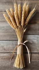 Beige Wheat Stalk Bundle Tied with Jute on Rustic Table