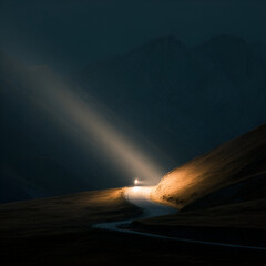Mysterious road illuminated by a distant light amidst dark, mountainous terrain at twilight
