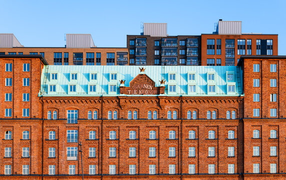 Stockholm, Sweden - June 3, 2025: The Mill Three Crowns is a former mill industry at Kvarnholmen, today a fancy apartment building.