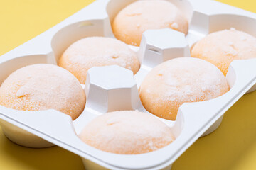 Japanese Mango ice cream mochi on yellow background