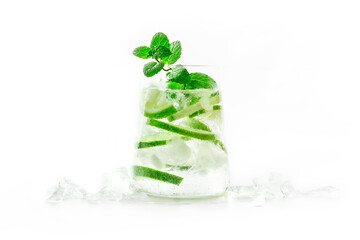 Lime lemonade, or limeade, in a glass with lime, mint, and plenty of ice, isolated on a white background. Fresh summer Mojito mocktail or cocktail