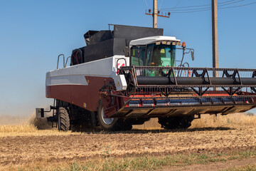 Wheat harvesting in the summer.  harvester working in the field