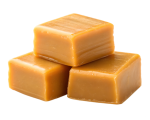 Three delicious caramel squares isolated on transparent background