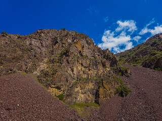 Dramatic rock formation in serene mountainous region during day