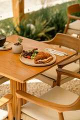 Cozy Outdoor Café Table with Turkish Tea and Colorful Brunch

