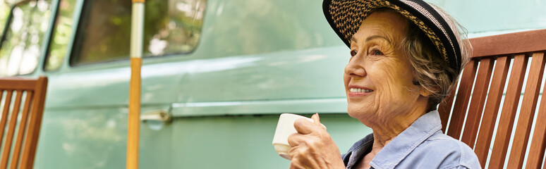 Senior woman enjoying a relaxing moment with coffee in a lush garden on a sunny afternoon