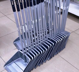 A stack of brooms and dust pans is a must-have for keeping your workspace tidy. Don't forget the little things like pens and writing implements to help you stay productive throughout the day!