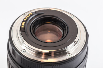 Close-up of rear end of DSLR zoom lens with bayonet ring and electrical contacts