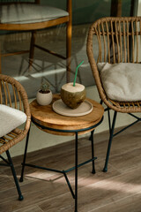 Tropical Coconut Drink Presentation in a Cozy Café

