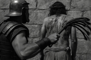 Jesus Whipped by Roman Soldier Before Crucifixion

Scourging of Jesus Before the Cross

Roman Soldier Flogging Christ in Biblical Scene

Passion of Christ Depicted in Black and White Imagery