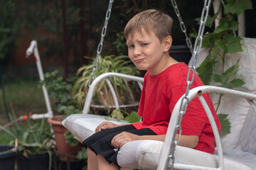 Portrait of a boy in a backyard garden