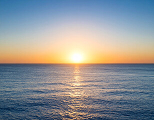 Serene Ocean Sunset: Golden Hues Over Calm Waters