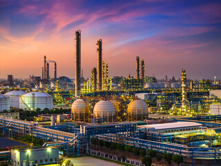Oil refinery and chemical plant in large industrial area at sunset