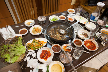 Set of Korean hotpot are eaten and left on tableasia, asian, asian cuisine, asian dishes, authentic, background, beef, broth, buffet dining, chopsticks, close up, concept, cook, cooking, cuisine, culi