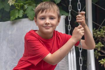 Portrait of a boy in a backyard garden