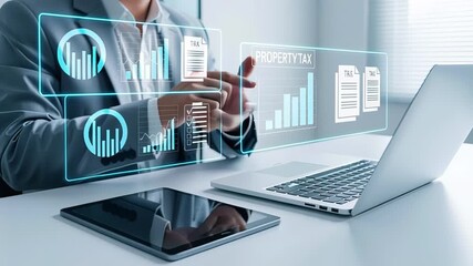 Businessman using laptop and tablet with digital interface showing property tax documents, charts and financial data. Concept of tax management, financial analysis and digital accounting
 - Powered by Adobe