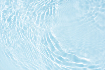 Blue water with ripples on the surface. Defocus blurred transparent blue colored clear calm water...