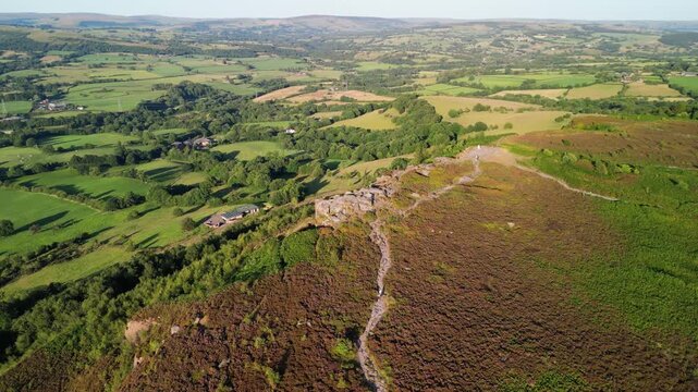 The stunning spiritual Cloud at Bosely on a full moon weekend during golden hour, Staffordshire UK - drone clockwise rotate from far