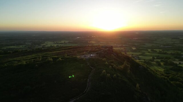 The stunning spiritual Cloud at Bosely on a full moon weekend at sunset , Staffordshire UK - drone clockwise rotate