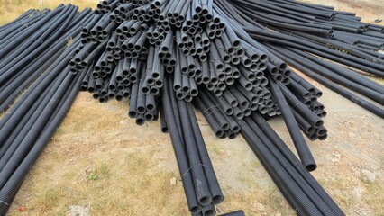 pile of corrugated conduit or corrugated ducting pipes