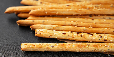 Grissini breadsticks whole grain cereal fresh delicious gourmet food background on the table rustic food top view copy space