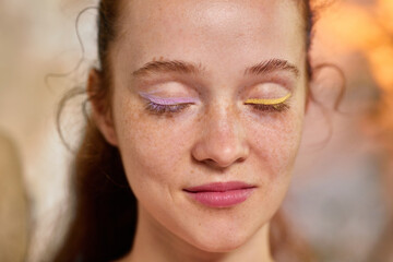 Bold Y2K. Beauty portrait of woman with closed eyes and pastel eyeliner. Concept of peaceful femininity, eye makeup trends, product advertising, skincare tutorials, modern beauty culture.