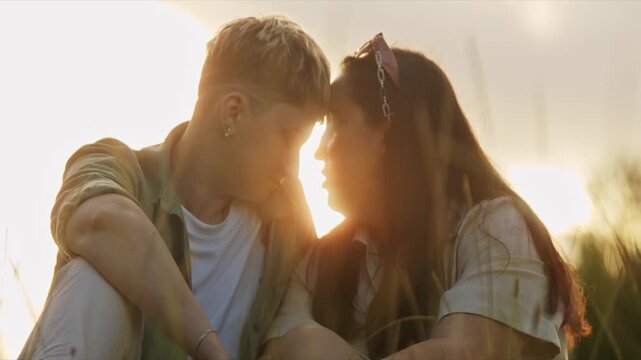 Young couple sharing intimate moments at sunset
