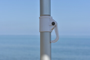 Parasol, sea, summer and holidays. 
Summer beach in Italy and beach umbrella offering shade under...