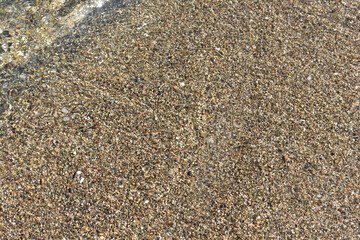 Natural background. Sand texture. Abstract background with sand. Spiaggia di Settefrati: beach near Cefalu, Sicily. Summer and holidays. Summer beach in Italy.