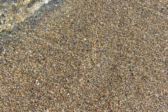 Natural background. Sand texture. Abstract background with sand. Spiaggia di Settefrati: beach near Cefalu, Sicily. Summer and holidays. Summer beach in Italy.