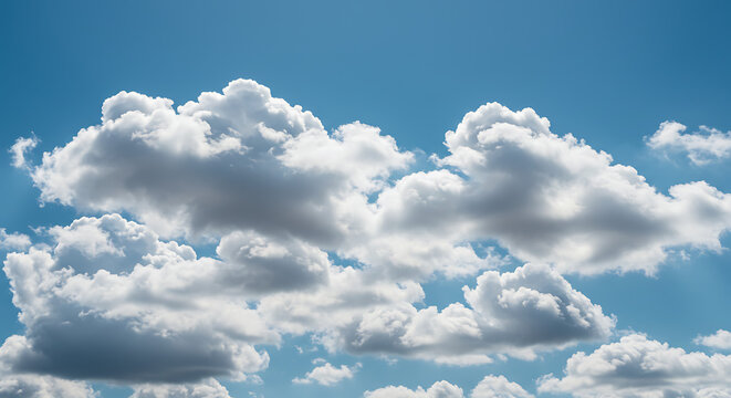 Clouds against a clear blue sky, ample negative space for text overlay