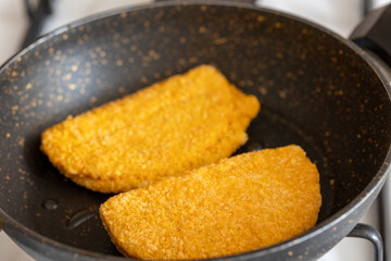 cordon bleu chicken nuggets with salami in close-up