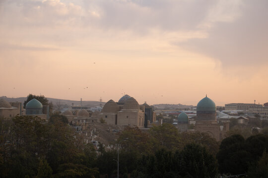 Sunrise over the roofs of Samarkand with a coudy sky