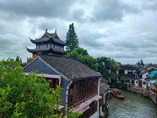 The beautiful canal behind the Yuanjin Temple with the old style of boat, Zhujiajiao Ancient Town.
