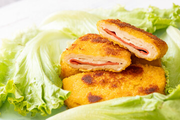 cordon bleu chicken nuggets with salami in close-up