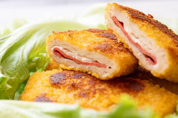 cordon bleu chicken nuggets with salami in close-up